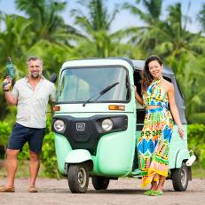 Hosts Stephanie Sitt and Luke Shantz rocking their tools with their Tuk Tuk, as seen on Betting on Paradise, Season 1.